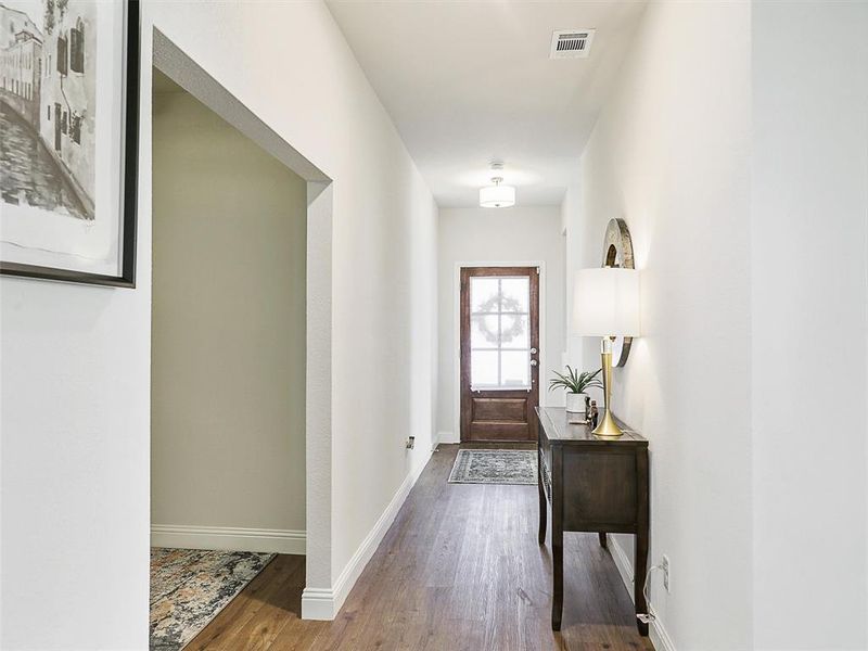 Doorway & entry with wood-type flooring