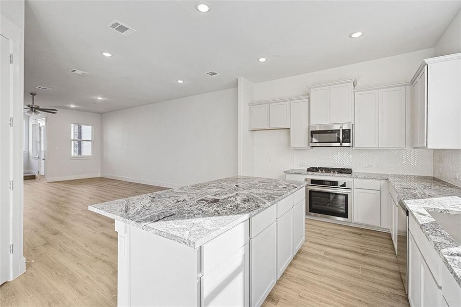 Furnished interior view inside a new home in Collin Creek, Plano (Image 11).