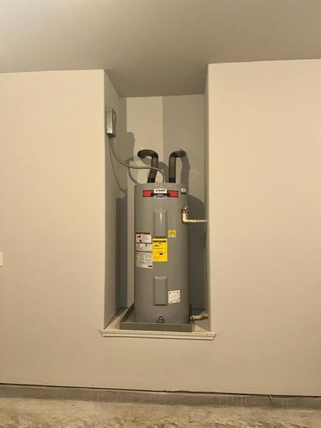 Hot water heater in the garage for easy access.