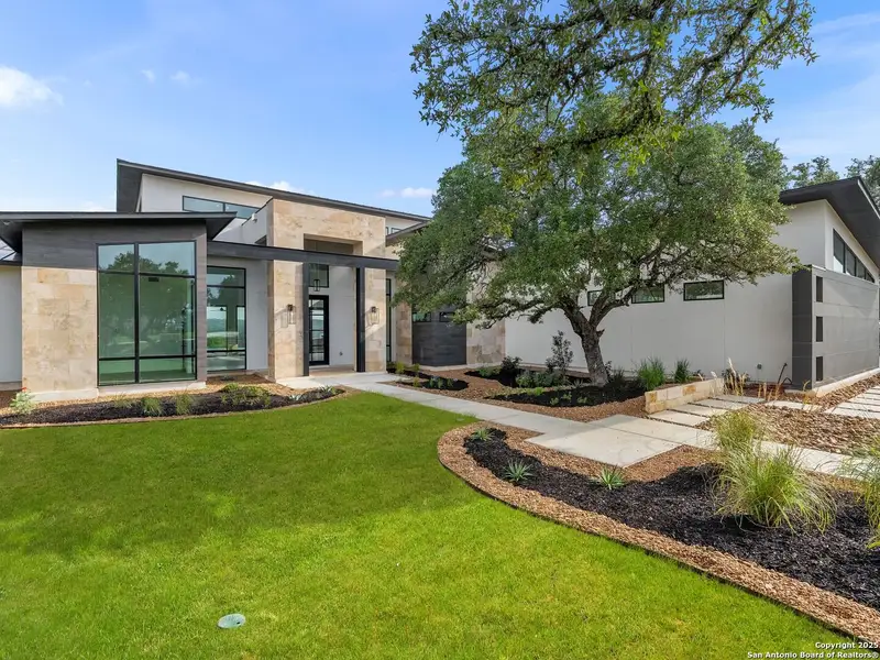 Front exterior of a new home in , Boerne, TX, highlighting curb appeal (Image 5).
