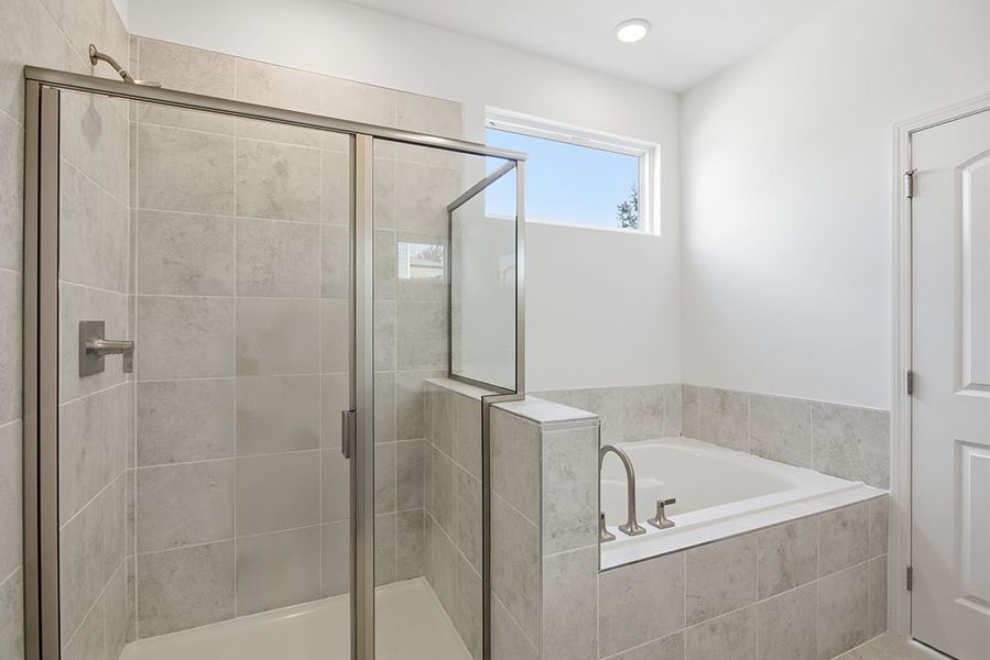 A bathroom with a glass shower. A bathroom with a glass shower.