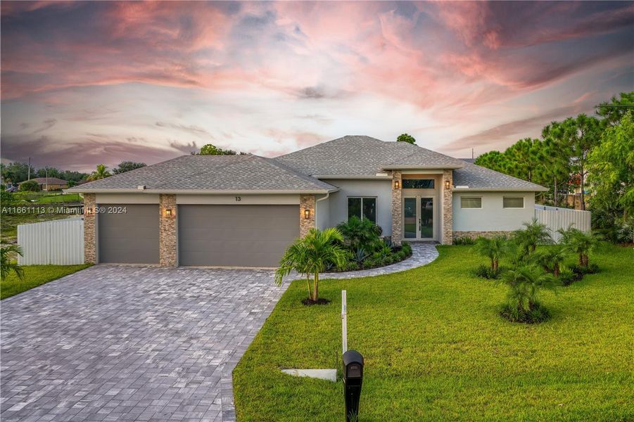 Front exterior of a new home in , Cape Coral, FL, highlighting curb appeal (Image 1).