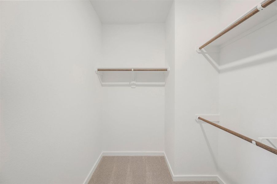 Primary walk-in closet Primary walk-in closet