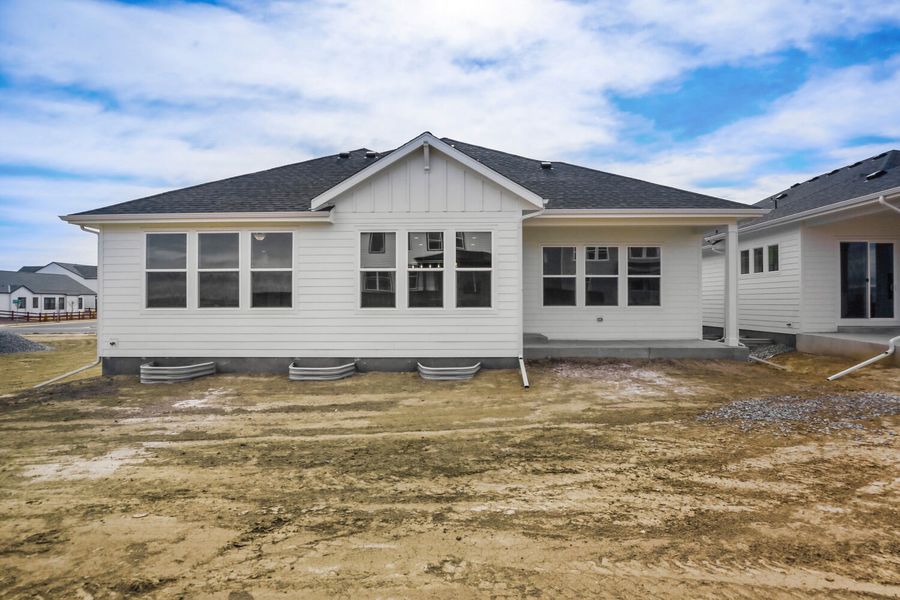 Exterior details and patio area of a home in RainDance, Windsor (Image 3).