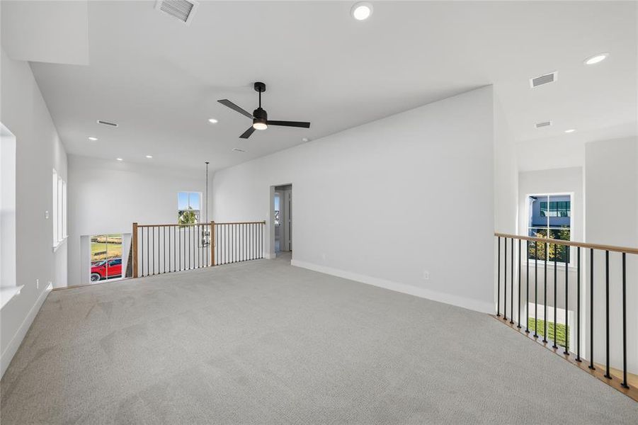 Empty room featuring recessed lighting, ceiling fan, and carpet floors