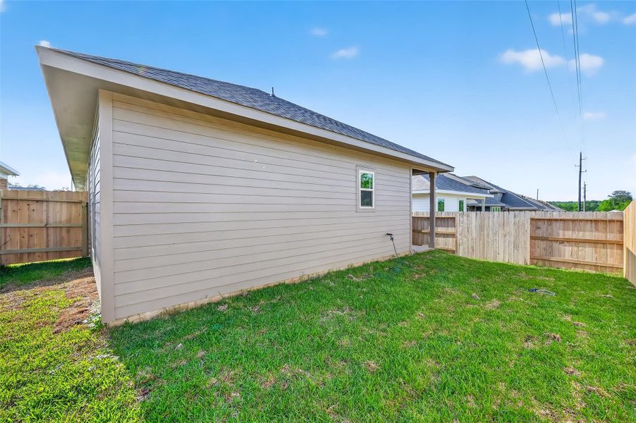 Exterior details and patio area of a home in Mostyn Springs, Magnolia (Image 21).