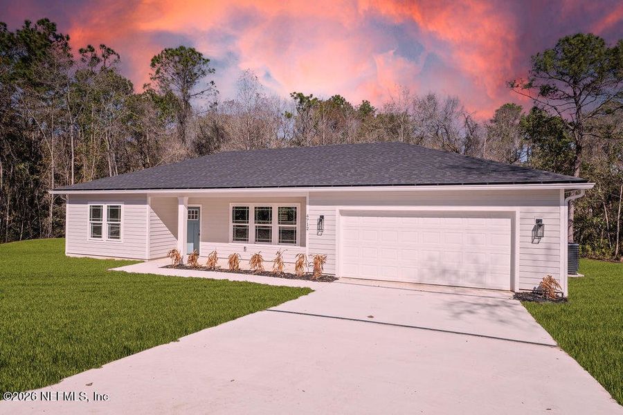 Front exterior of a new home in , Middleburg, FL, highlighting curb appeal (Image 14).