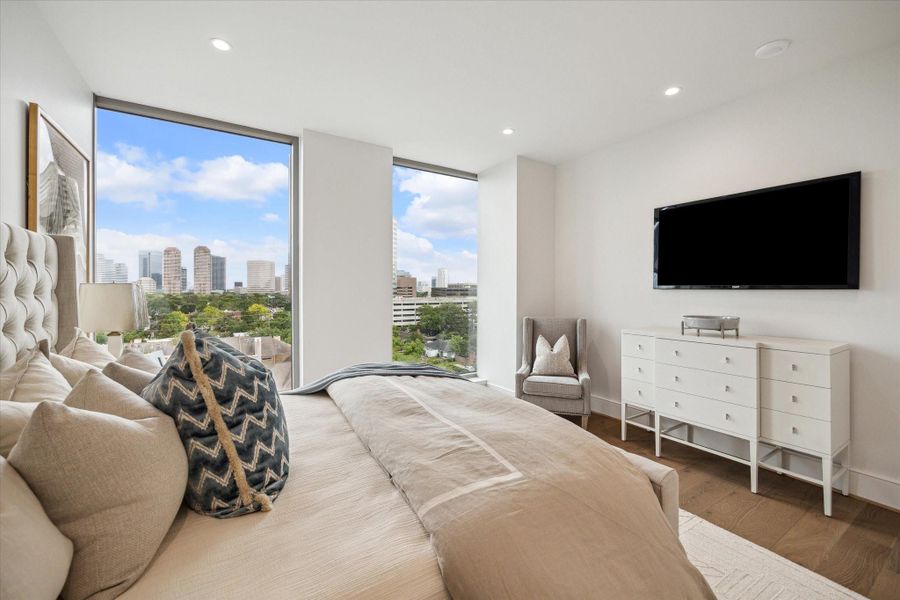 Take a moment to unwind, settle in this primary bedroom cozy corner, find a great read and take in the beautiful downtown views to the East. Photo of a similar unit with same layout.