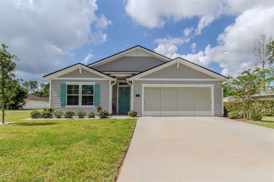 Front exterior of a new home in Palm Coast Homesites, Palm Coast, FL, highlighting curb appeal (Image 22).