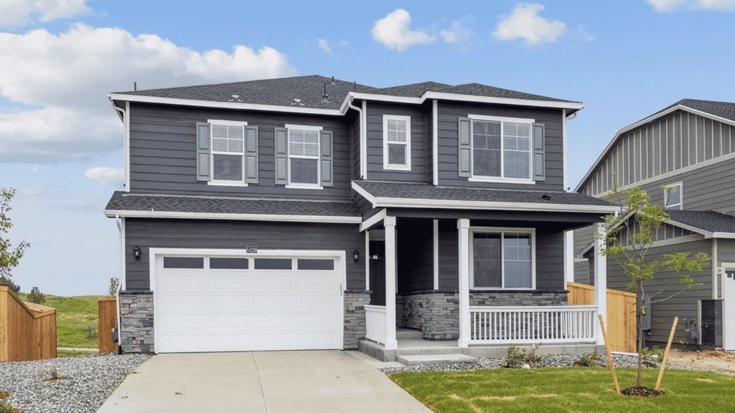 Front exterior of a new home in Trails at Crowfoot, Parker, CO, highlighting curb appeal (Image 1). Front exterior of a new home in Trails at Crowfoot, Parker, CO, highlighting curb appeal (Image 1).
