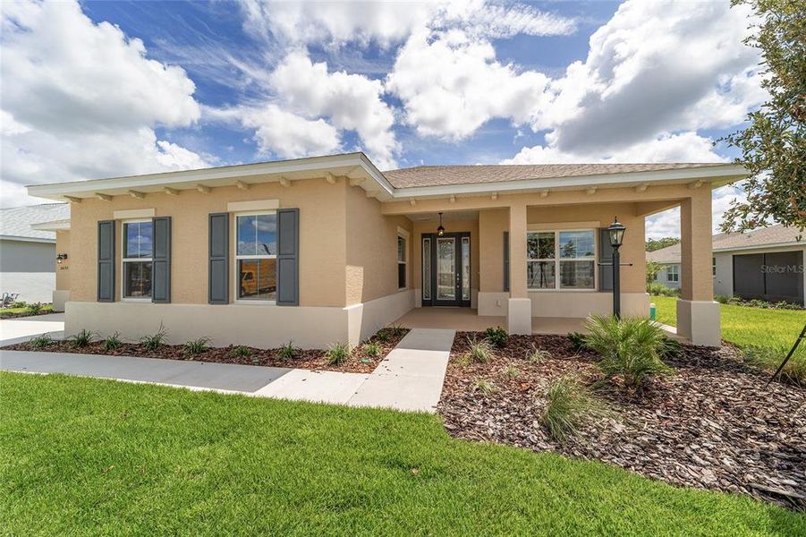 Front exterior of a new home in On Top of the World Communities, Ocala, FL, highlighting curb appeal (Image 23).