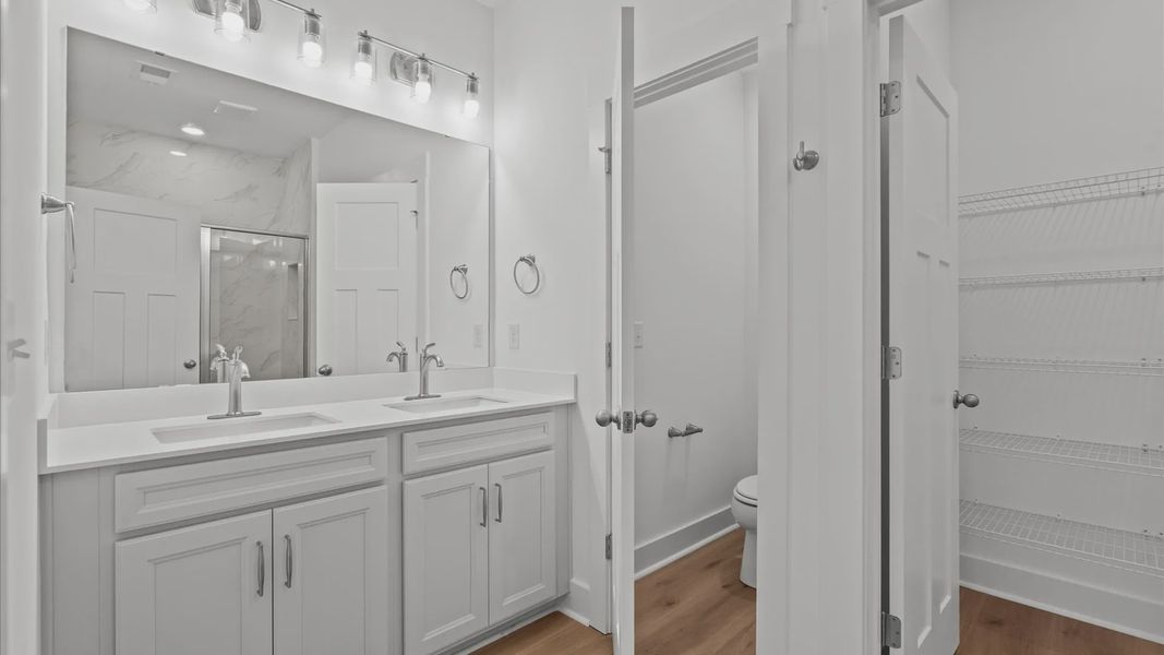 Superior en-suite primary bathroom with stylish dual vanity and walk-in shower—crafted with high standards in mind in SC