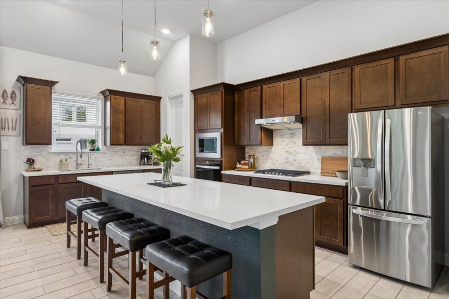 Seamless flow from the kitchen to the dining space makes meal prep and serving a breeze. Seamless flow from the kitchen to the dining space makes meal prep and serving a breeze.