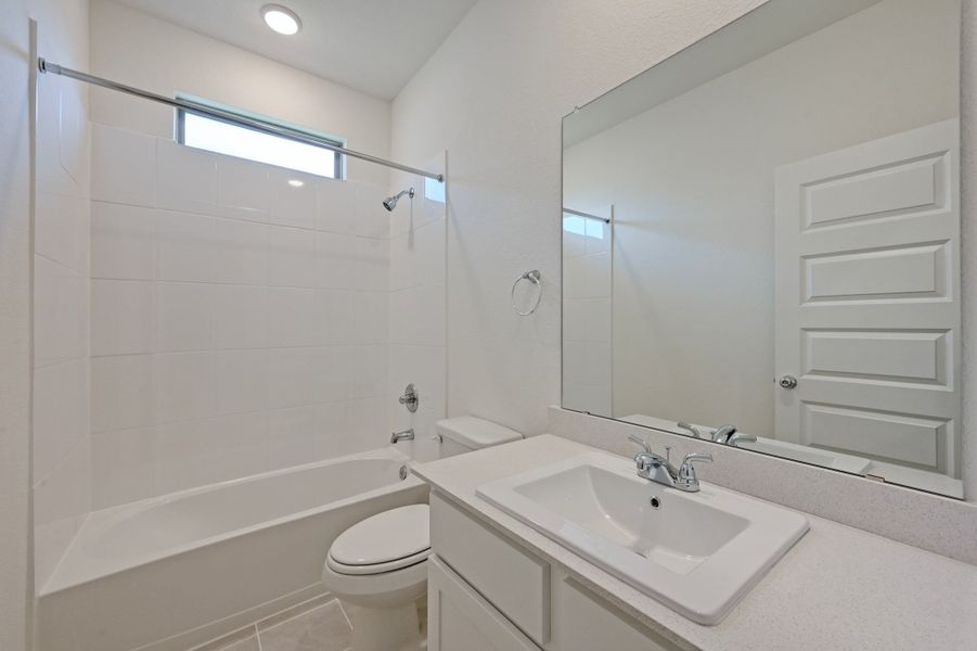 Bathroom in the Cedar home plan by Trophy Signature Homes – REPRESENTATIVE PHOTO
