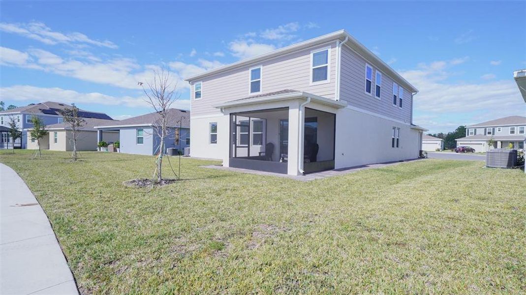 Front exterior of a new home in Providence, Davenport, FL, highlighting curb appeal (Image 25). Front exterior of a new home in Providence, Davenport, FL, highlighting curb appeal (Image 25).
