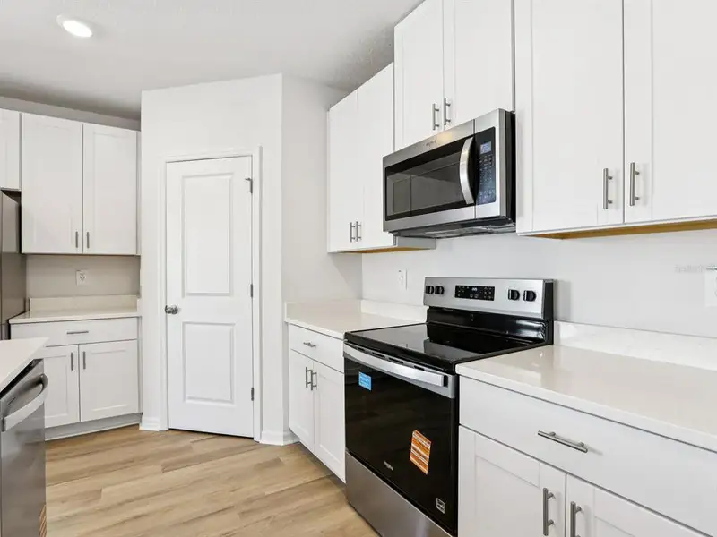 Furnished interior view inside a new home in Hilltop Vistas, Dade City (Image 6).