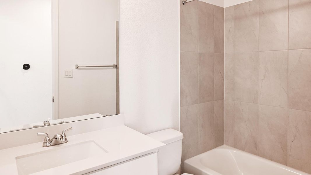 Full bathroom with vanity, toilet, and shower / bath combination