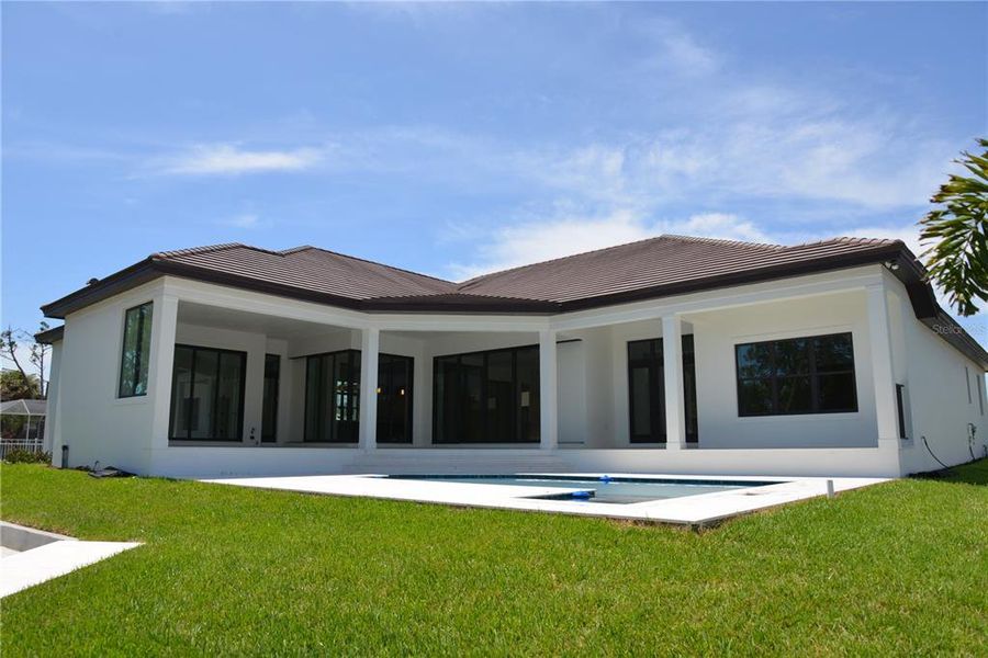 Front exterior of a new home in , Sarasota, FL, highlighting curb appeal (Image 13).