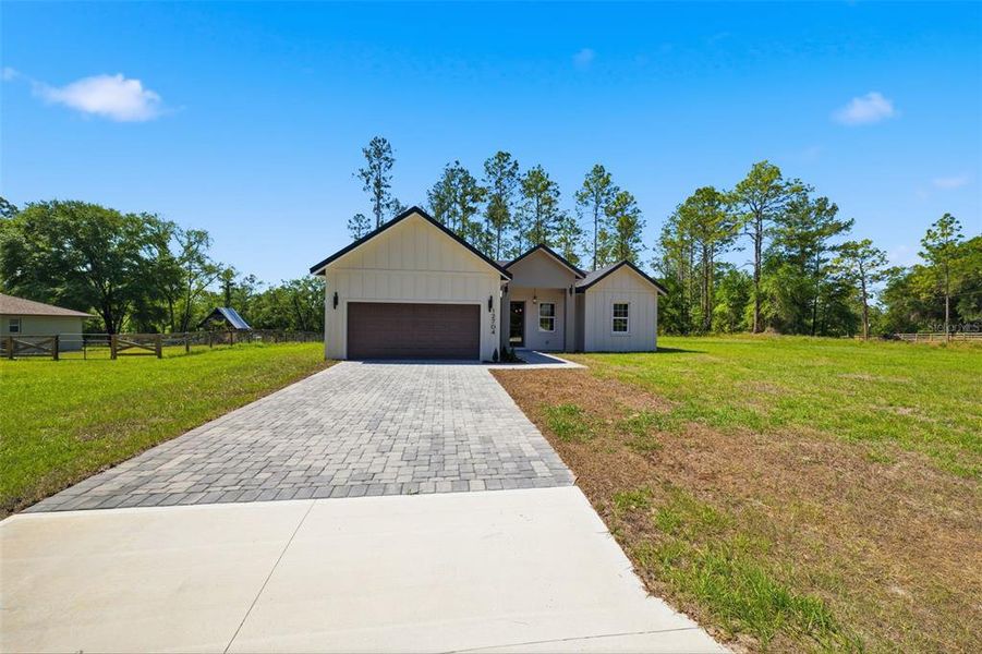 Front exterior of a new home in , Ocala, FL, highlighting curb appeal (Image 2). Front exterior of a new home in , Ocala, FL, highlighting curb appeal (Image 2).