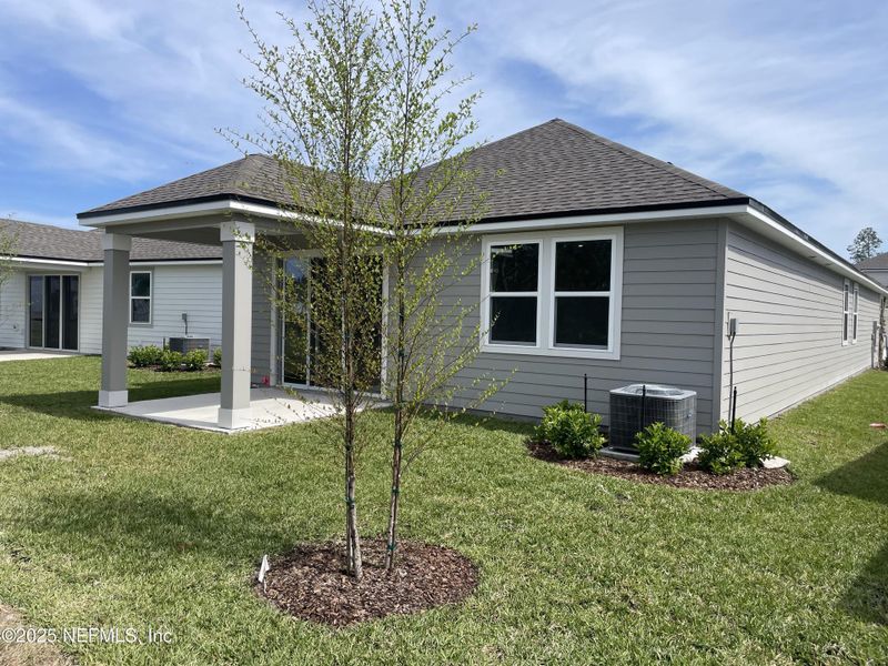 Exterior details and patio area of a home in Palm Series at Seminole Palms, Palm Coast (Image 26).
