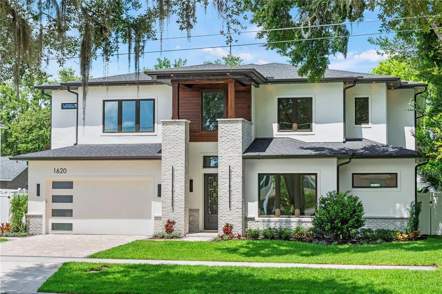 Front exterior of a new home in , Orlando, FL, highlighting curb appeal (Image 42). Front exterior of a new home in , Orlando, FL, highlighting curb appeal (Image 42).