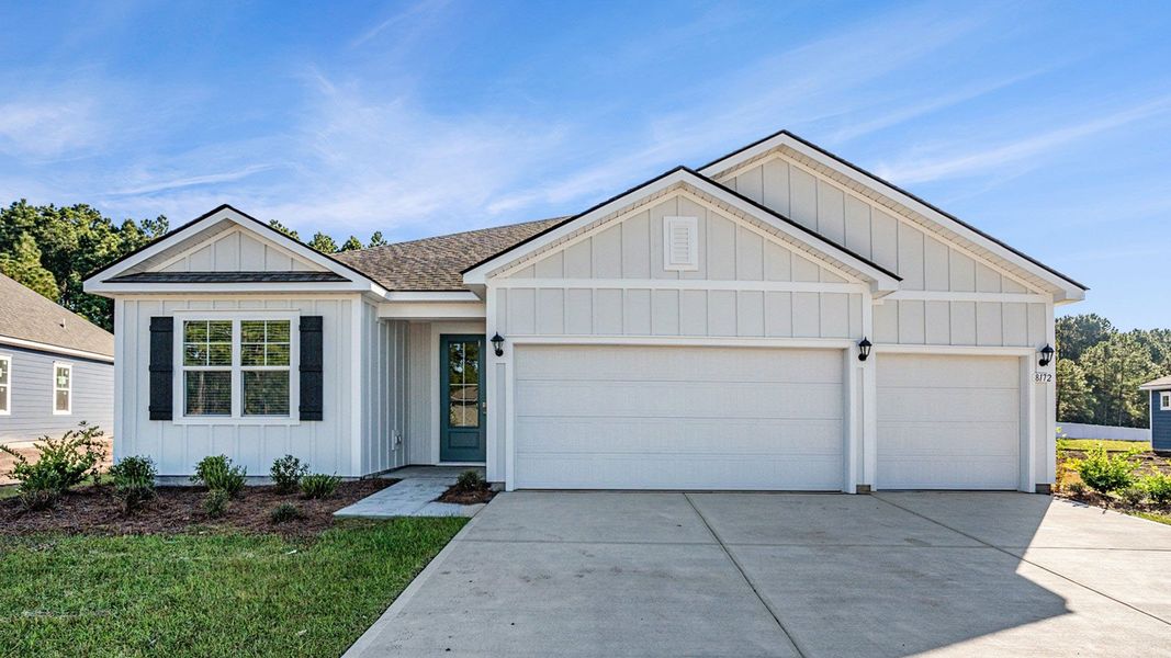Front exterior of a new home in Auberon Woods, Conway, SC, highlighting curb appeal (Image 1). Front exterior of a new home in Auberon Woods, Conway, SC, highlighting curb appeal (Image 1).