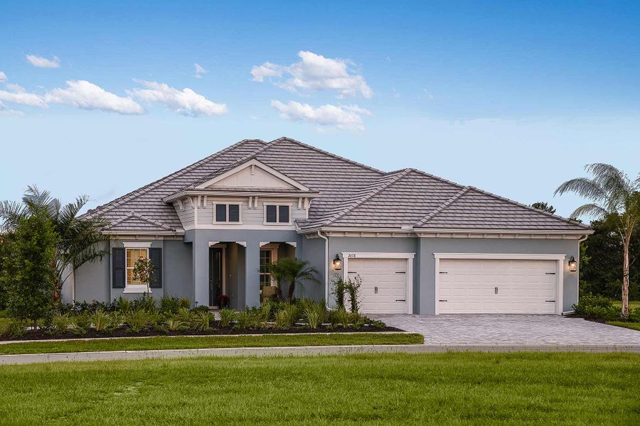 Front exterior of a new home in Windward, Lakewood Ranch, FL, highlighting curb appeal (Image 23).
