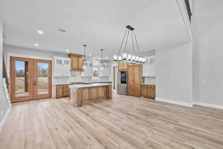 Furnished interior view inside a new home in , New Waverly (Image 6).