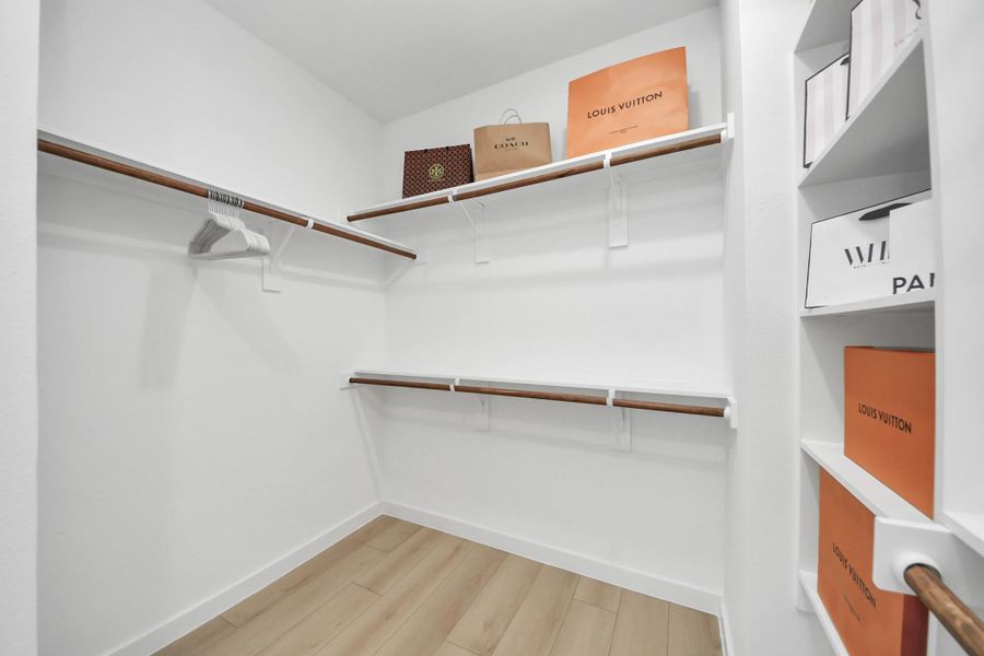 Primary walk-in closet Primary walk-in closet