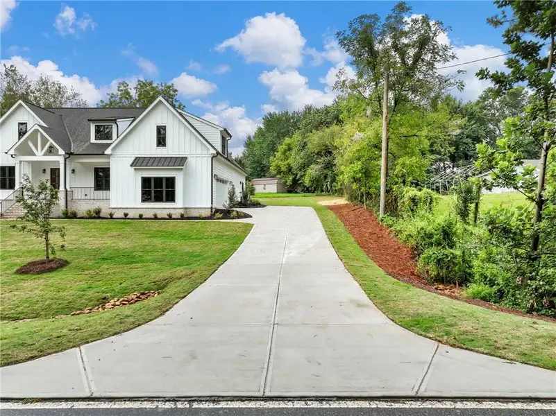Front exterior of a new home in , Cumming, GA, highlighting curb appeal (Image 33). Front exterior of a new home in , Cumming, GA, highlighting curb appeal (Image 33).