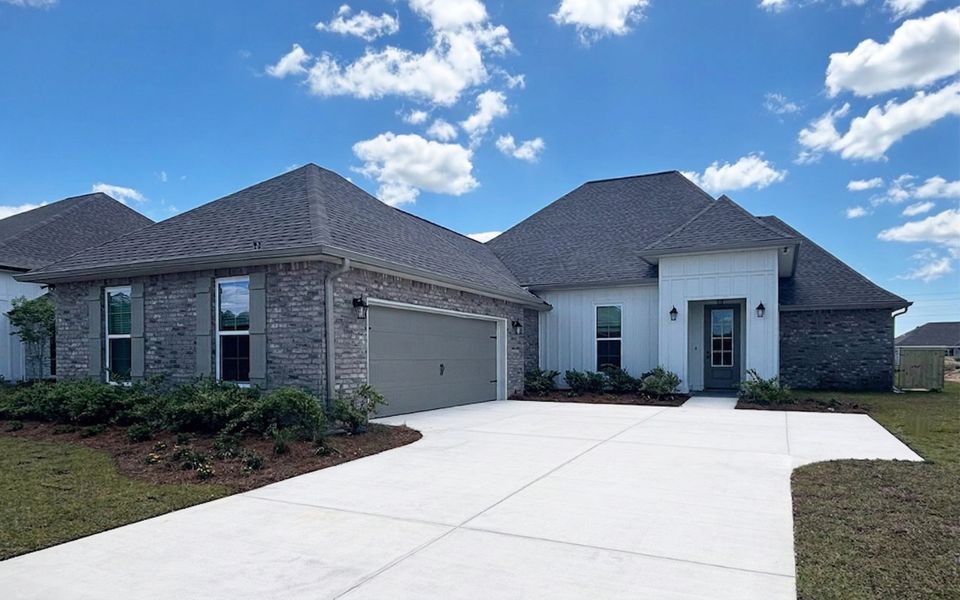 Front exterior of a new home in Natureview, Freeport, FL, highlighting curb appeal (Image 18). Front exterior of a new home in Natureview, Freeport, FL, highlighting curb appeal (Image 18).