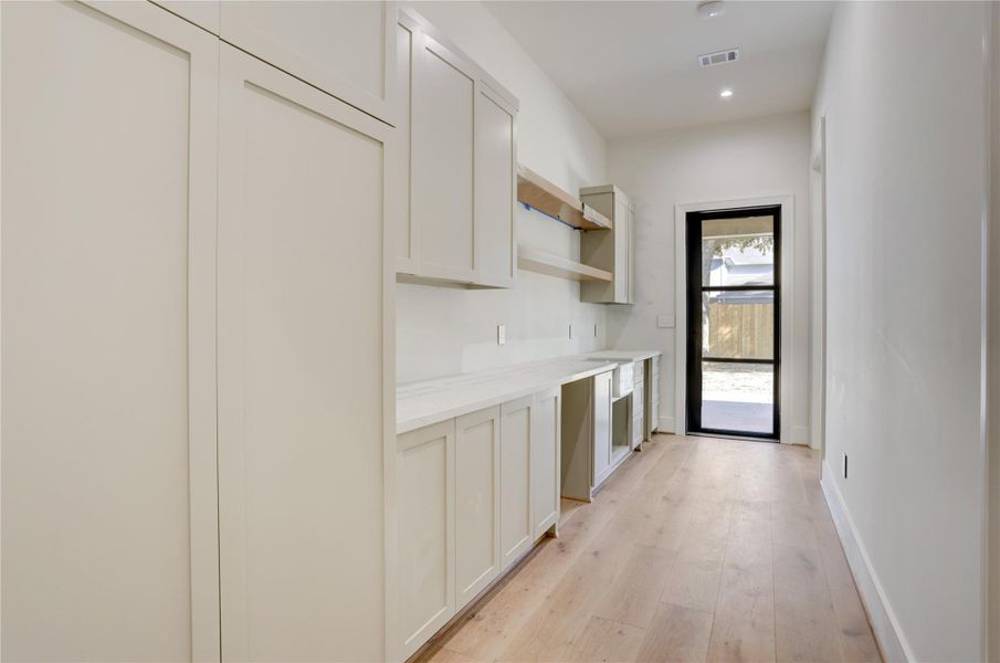 Expanded butlers pantry just off the kitchen/dining out onto the covered veranda and backyard, perfect for gatherings. Expanded butlers pantry just off the kitchen/dining out onto the covered veranda and backyard, perfect for gatherings.