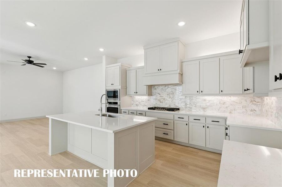 Fantastic storage paired with beautiful finishes combine to create the kitchen of your dreams in our Bella plan!  REPRESENTATIVE PHOTO