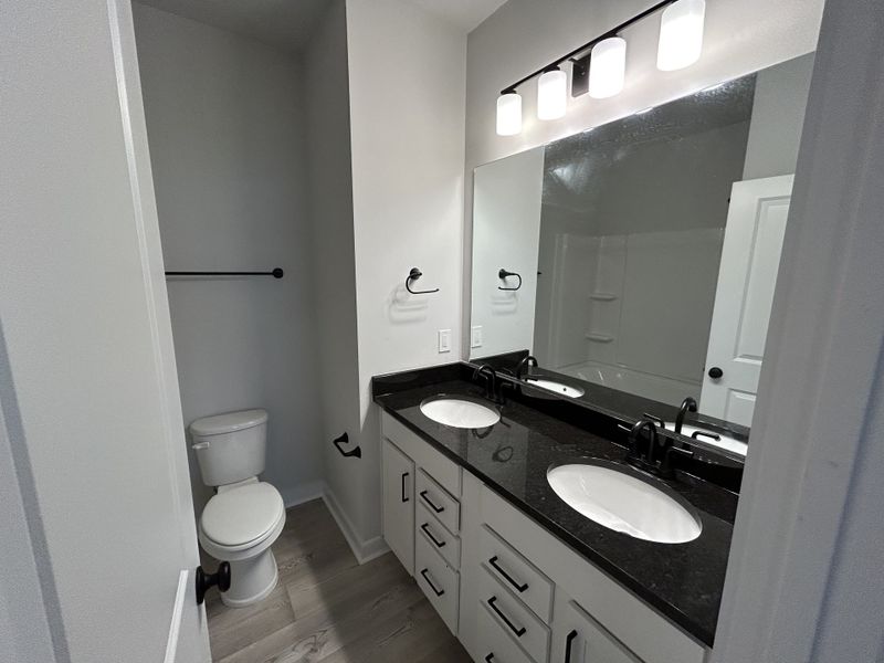 Furnished interior view inside a new home in Hickory Cove, Burns (Image 9).