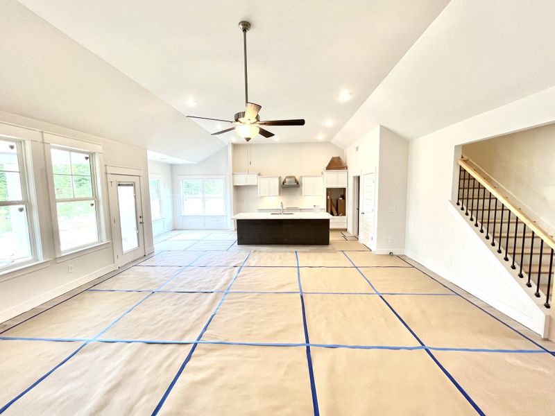 stock photo showing size of the Great Room and stairs leading to bonus room and full bathroom