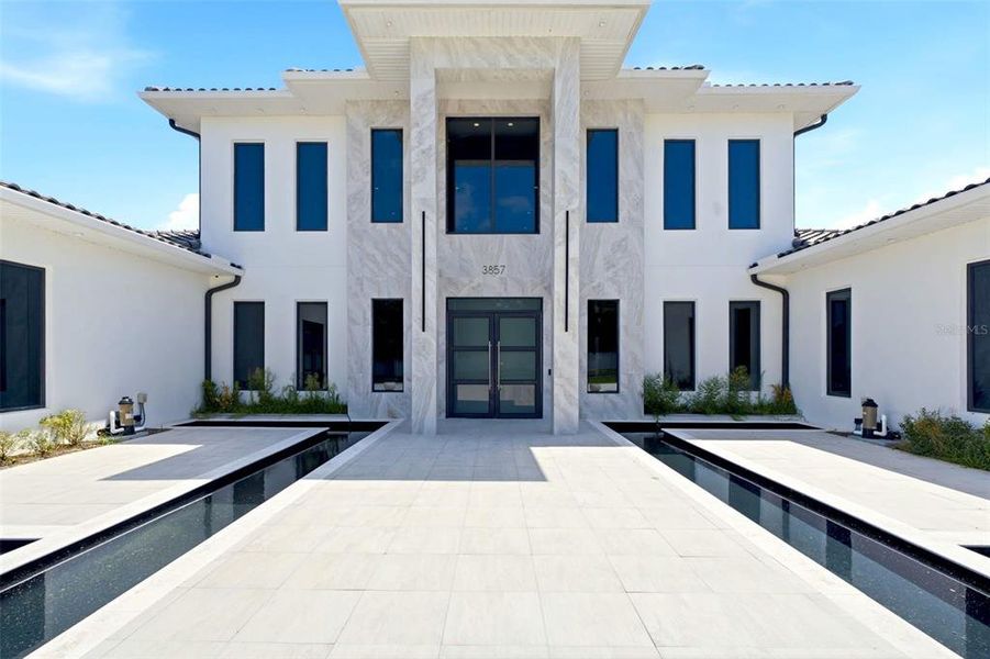 Front exterior of a new home in , Lake Mary, FL, highlighting curb appeal (Image 23). Front exterior of a new home in , Lake Mary, FL, highlighting curb appeal (Image 23).
