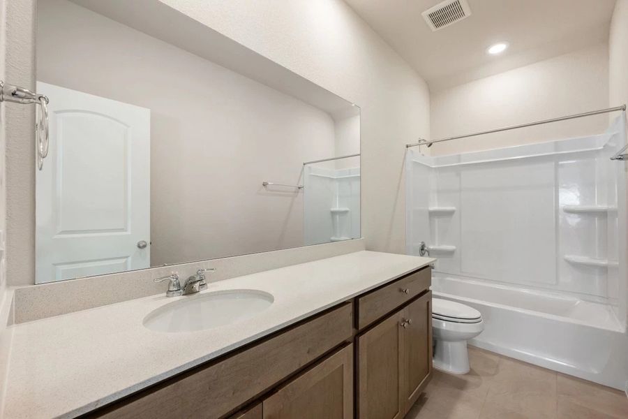 Furnished interior view inside a new home in The Colony, Bastrop (Image 18).
