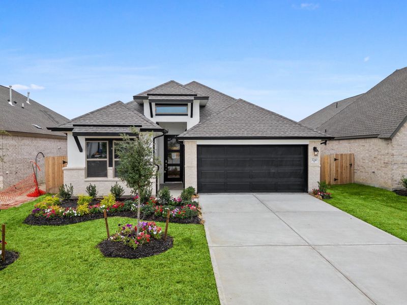 Front exterior of a new home in , Spring, TX, highlighting curb appeal (Image 25).