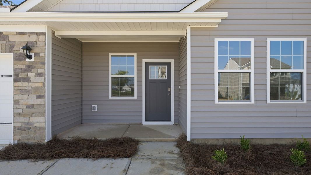 Exterior details and patio area of a home in Tyler - Home on the Lake, New Bern (Image 3).