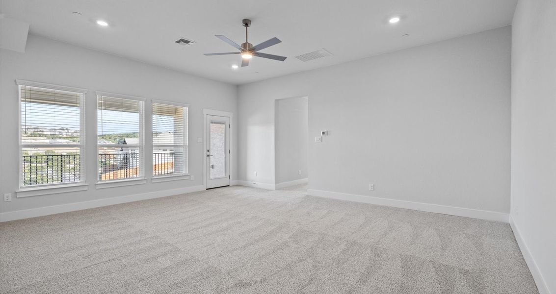 Representative unfurnished interior of a home built from the Raegan by Chesmar Homes in Sweetwater, Austin (Image 12).