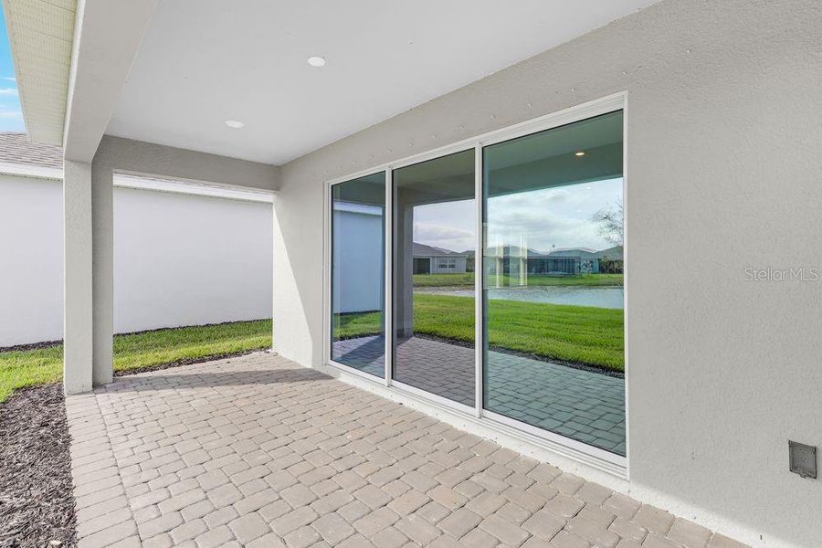 Exterior details and patio area of a home in The Cove at West Port, Port Charlotte (Image 20).