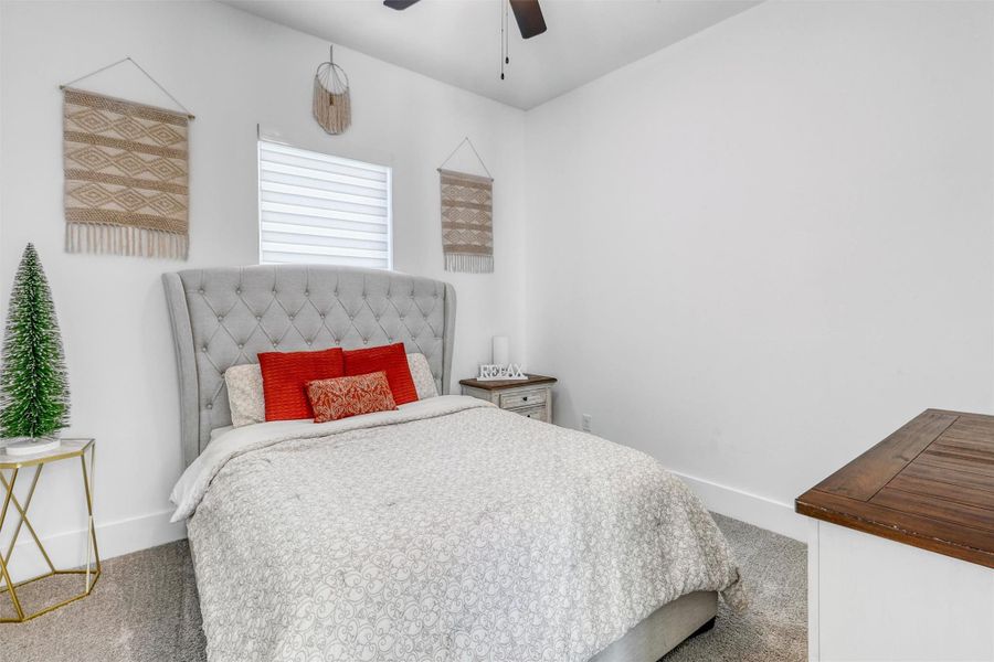 This fifth bedroom in the casita has plush carpeting, ceiling fan, and a full ensuite bathroom. Perfect for any guest!
