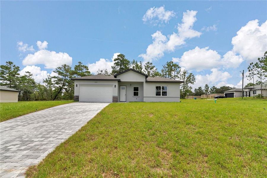 Front exterior of a new home in , Citrus Springs, FL, highlighting curb appeal (Image 19). Front exterior of a new home in , Citrus Springs, FL, highlighting curb appeal (Image 19).