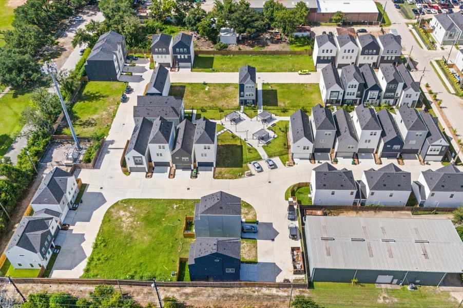 Showcasing the full scope of the neighborhood, this stunning aerial view captures the community’s thoughtful layout, lush green spaces, and inviting shared amenities. This bird’s-eye perspective highlights the seamless blend of architecture and nature. Ideal for getting a true sense of scale, proximity, and lifestyle, this elevated view paints a vivid picture of what it means to live here. Showcasing the full scope of the neighborhood, this stunning aerial view captures the community’s thoughtful layout, lush green spaces, and inviting shared amenities. This bird’s-eye perspective highlights the seamless blend of architecture and nature. Ideal for getting a true sense of scale, proximity, and lifestyle, this elevated view paints a vivid picture of what it means to live here.