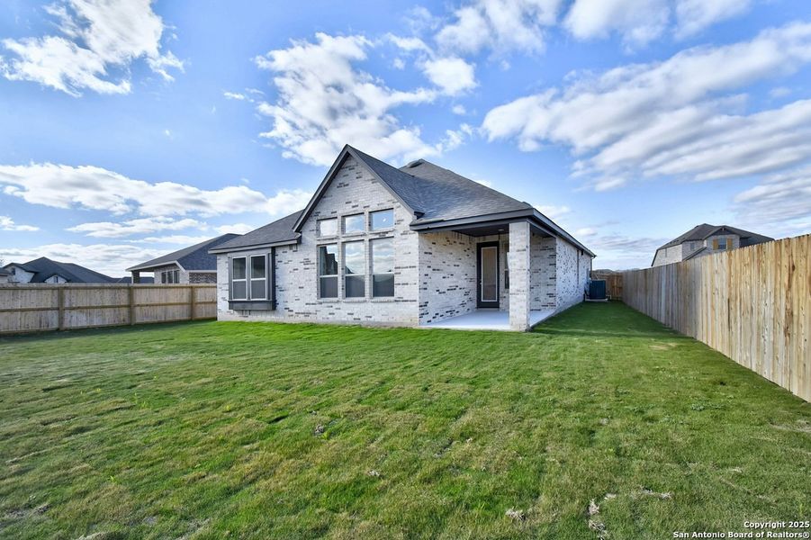 Front exterior of a new home in Alsatian Oaks: 50ft. lots, Castroville, TX, highlighting curb appeal (Image 2). Front exterior of a new home in Alsatian Oaks: 50ft. lots, Castroville, TX, highlighting curb appeal (Image 2).