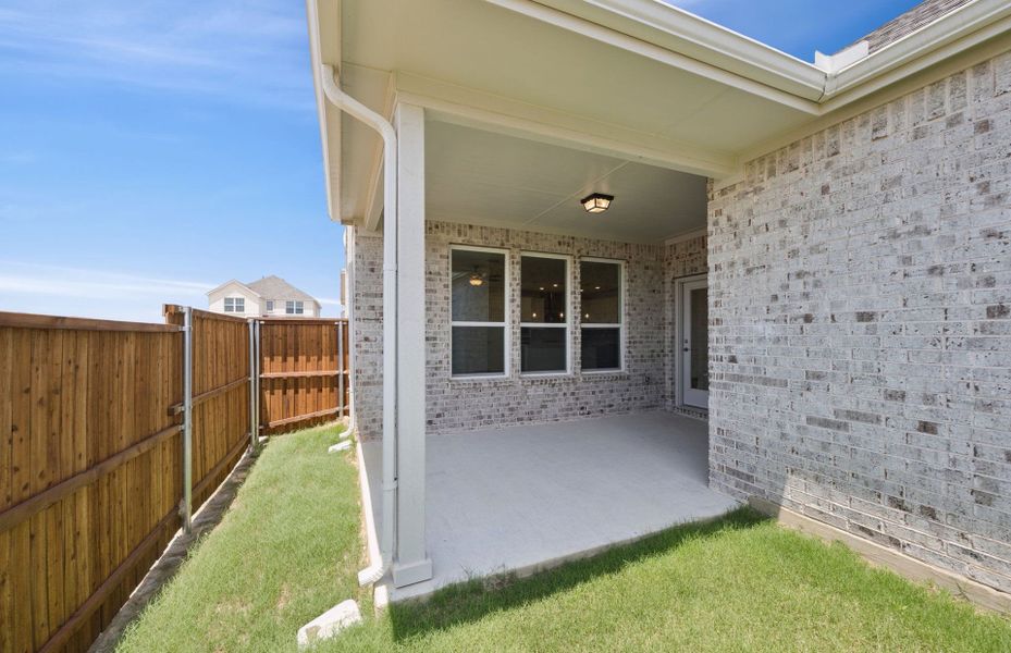Exterior details and patio area of a home in Pinnacle at Legacy Hills, Celina (Image 2). Exterior details and patio area of a home in Pinnacle at Legacy Hills, Celina (Image 2).