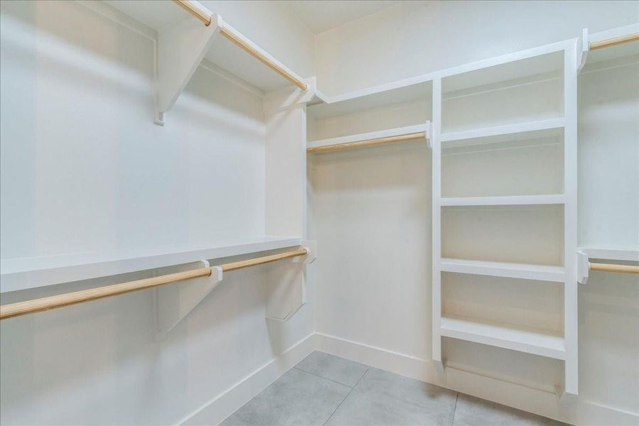 The oversized walk-in closet offers ample space for clothes, shoes, and much more.