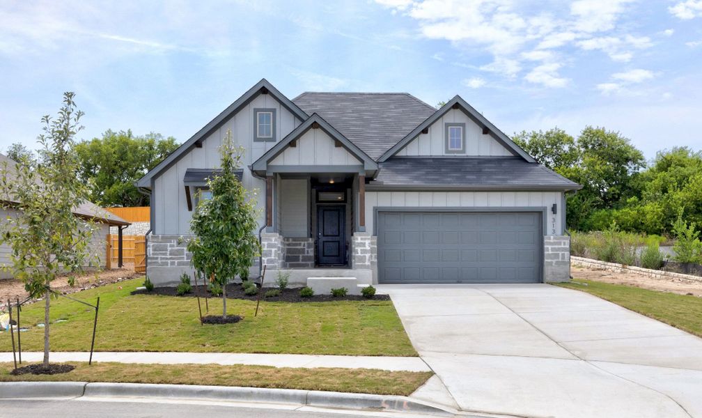 Front exterior of a new home in Prairie Winds, Hutto, TX, highlighting curb appeal (Image 18).