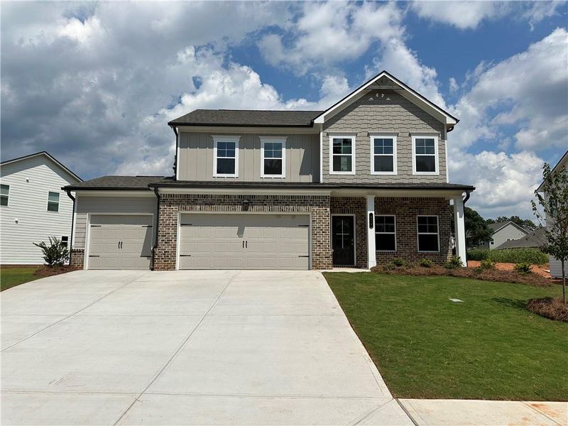 Front exterior of a new home in Rosewood Lake Estates, Hoschton, GA, highlighting curb appeal (Image 65).