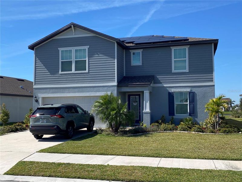 Front exterior of a new home in , Parrish, FL, highlighting curb appeal (Image 22).
